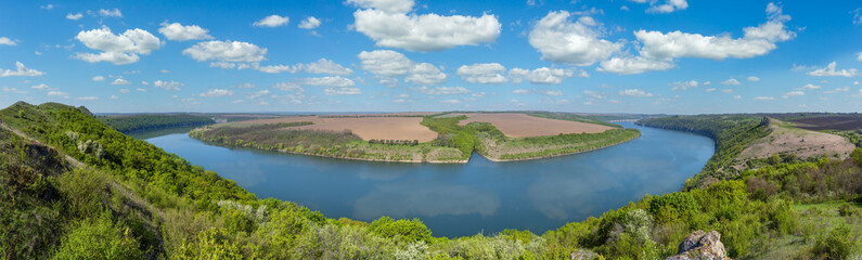 Naklejka premium Amazing spring view on the Dnister River Canyon with picturesque rocks, fields, flowers. This place named Shyshkovi Gorby, Nahoriany, Chernivtsi region, Ukraine.