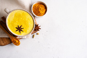 Turmeric health latte with spice and powder on white background,