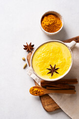Turmeric health latte with spice and powder on white background,