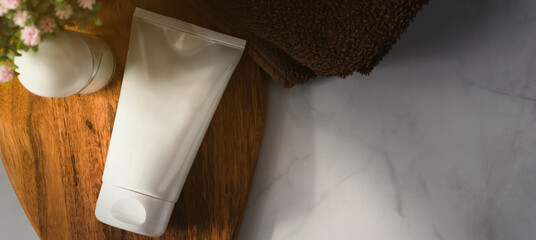 Banner of desodorant and cream tube for mockup on bath dreamy scenery. Bath still life with copy space. Beauty lifestyle composition.