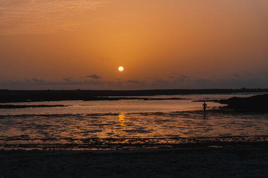 Sunset on a virgin and paradisiacal beach
