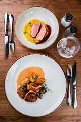 medallions of beef with baked mini potatoes with mushrooms