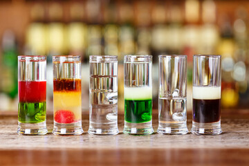 Many colorful cocktails on the bar