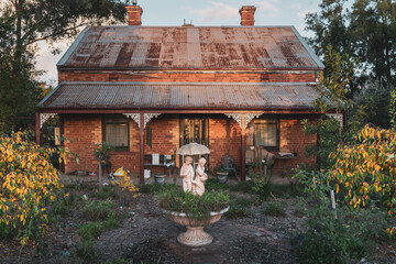 old house garden with sculptured fountain