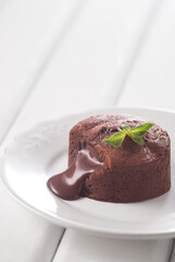 Chocolate fountain, cupcake. Photo of food on a white background