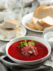 Ukrainian national dish red borscht with bread. food photography