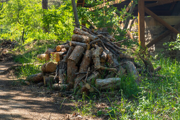 Fototapeta na wymiar Preparation of firewood for the winter. firewood background, Stacks of firewood