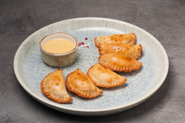 posikunchiki with mustard sauce. traditional cuisine of Russia, the Urals