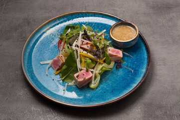 salad with vegetables, fried tuna and honey mustard sauce