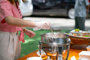 scooping the food, catering, dinner time