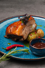 pork belly with new potatoes, tomato sauce and green butter