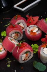 sushi rolls with tuna, omelette, shrimp and cream cheese