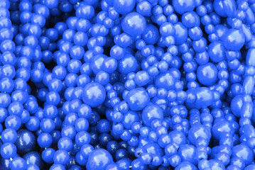 Beautiful abstract blue background made of wooden blue beads