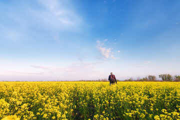 man looks at the sky. bright spring landscape