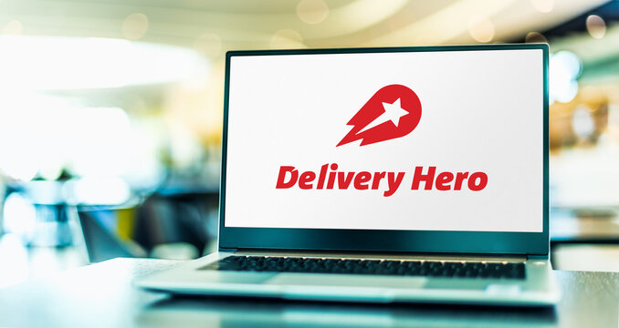 Laptop computer displaying logo of Delivery Hero