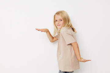 happy child with blond hair on a light background