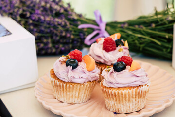 cupcakes with cream and berries