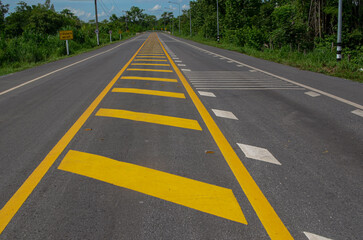 Fototapeta na wymiar road with yellow lines