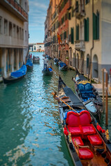 Gondolas moored in a side canal in Venice, Italy 