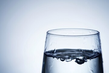 Close-up shot of pouring water into a glass