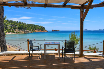 Beautiful restaurant view towards Chrisi Milia beach in Alonissos island, Greece