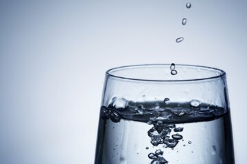 Close-up shot of pouring water into a glass