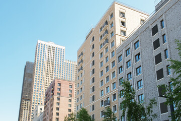 Quarter of multi-storey residential buildings of standard construction. View of new high-rise buildings against the blue sky.