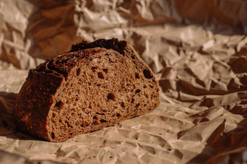 loaf of bread on crumpled craft paper