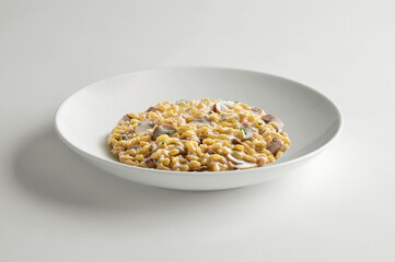 White bowl with porcini mushroom risotto