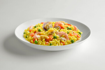 White bowl with portion of fish paella with saffron vegetables