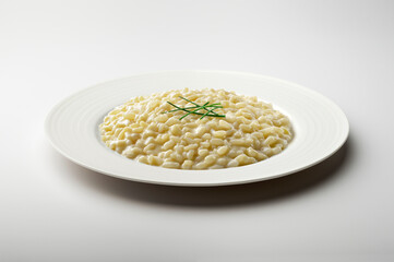 White dinner plate with parmesan cheese risotto and chives
