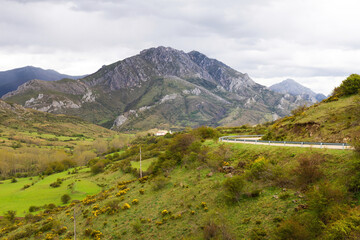Mountain landscape with road and town, Province of Leon, Spain