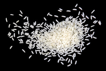 A pile of white uncooked rice grains, lying flat.	
