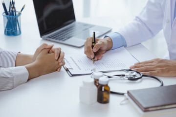 Doctors are giving advice on treatment to patients in hospital examination rooms, treating diseases from specialists and providing targeted treatment. Concepts of medical treatment and specialists.