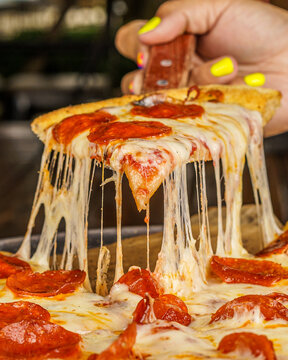 Pepperoni Pizza Slice with cheese Melting