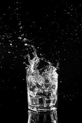 Ice fell in a votka glass.