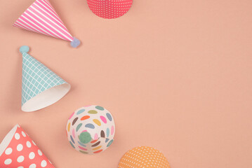 Colorful birthday cap on brown  background.