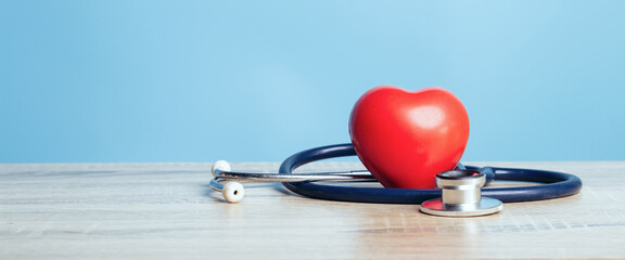 Stethoscope and a red heart. Concepts of a physical examination and Insurance health live concept.