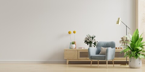 Living room with wooden cabinet and armchair on white wall background.