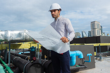 Engineer under checking the industry chilled water fan coil unit air conditioner is water cooling...