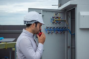 Engineer under checking the industry chilled water fan coil unit air conditioner is water cooling...