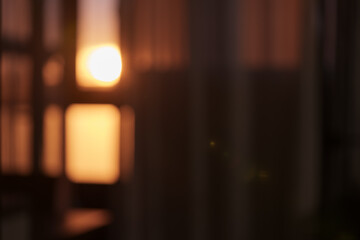 Blurred indoor background with sunset light