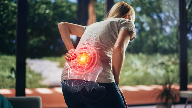 VFX Back Pain Augmented Reality Render. Close Up of a Female Experiencing Discomfort in a Result of Spine Trauma or Arthritis. Massaging and Stretching the Back to Ease the Injury.