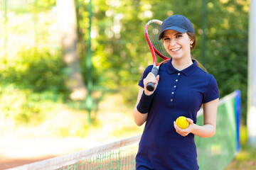 Professional girl athlete playing tennis on court. female player with racket, ball near net...