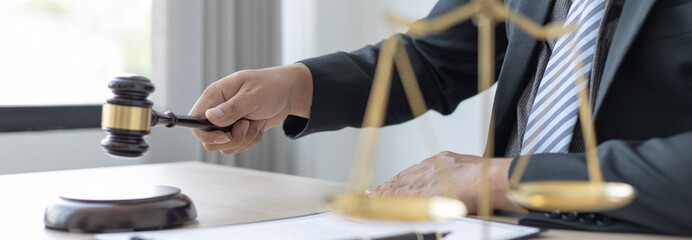 Lawyer or judge holding Hammer prepares to judge the case with justice, Legal consulting services and  litigation, scales of justice, law hammer, Concept of litigation and legal services