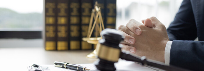 Lawyers or judges sign documents in accordance with legal and fair terms of agreement, Legal Ethics and Integrity, scales of justice, law hammer, Litigation and legal services.