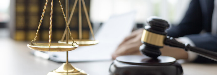 Lawyers or judges sign documents in accordance with legal and fair terms of agreement, Legal Ethics and Integrity, scales of justice, law hammer, Litigation and legal services.