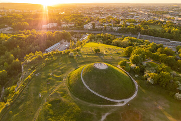 Aerial view of the Krakus Mound with sunset view of the Krakow old town, Poland