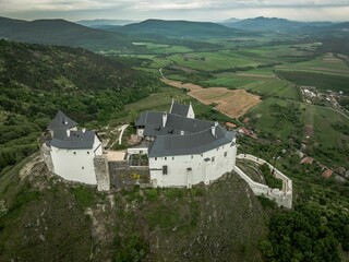 Fototapeta na wymiar Aerial View Of A Medieval Castle On A Hilltop In Fuzer, Hungary
