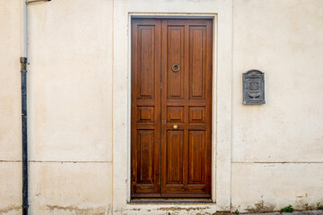 Brown door with golden knocker